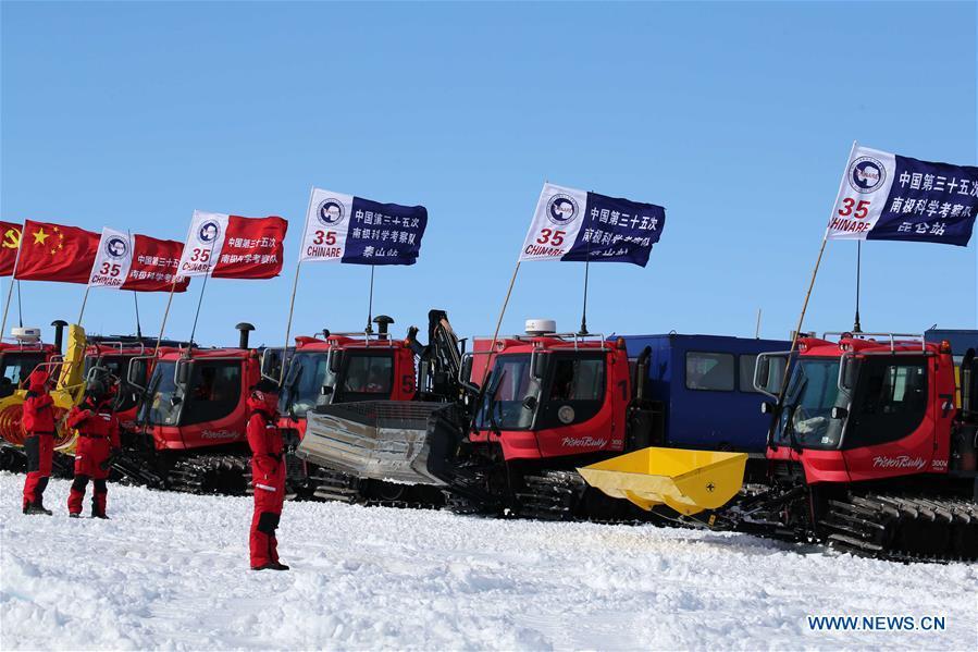 Chinese researchers wait to leave by snowmobile in Antarctica Dec. 18, 2018. China\'s 35th Antarctic expedition on Tuesday sent 37 members of two inland expedition teams to the Kunlun and Taishan stations. (Xinhua/Liu Shiping)