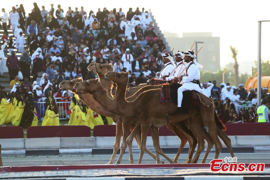 Qatari policemen ride camels during Qatar\'s National Day celebrations in Doha, Qatar, Dec. 18, 2018. (Photo/Agencies)