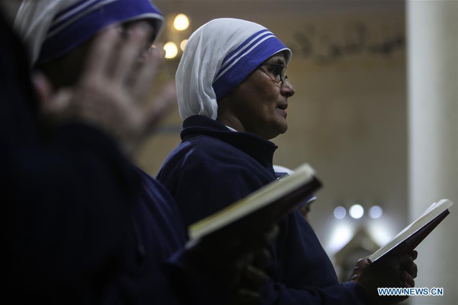 A Christian worshipper attends a Christmas mass at the Der Latin Church in Gaza City, on Dec. 24, 2018. (Xinhua/Stringer)