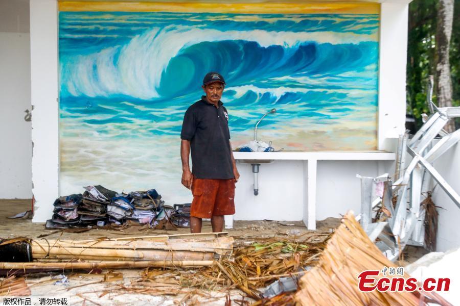A worker stands in front of a mural inside a destroyed resort bar which was hit by a tsunami in Tanjung Lesung, Banten province, Indonesia, Dec. 24, 2018. Indonesian military and rescue teams fanned out across a stretch of coastline on Monday, hoping to find survivors of a tsunami triggered by a landslide from a volcano that killed at least 373 people. (Photo/Agencies)