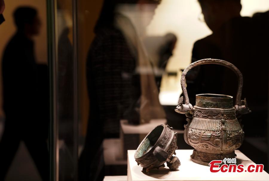 Cultural relics, including bronze wares and silver ingots, retrieved by police are on display at an exhibition at the National Museum of China in Beijing, Dec. 26, 2018. The exhibition displays 750 precious artifacts retrieved during police efforts in recent years fighting crime involving stolen cultural treasures, which hail from Neolithic times through to the Qing Dynasty. (Photo: China News Service/Du Yang)