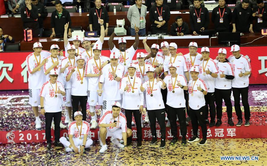 File photo taken on April 22, 2018 shows members of Liaoning team pose for pictures during the awarding ceremony for 2017-2018 Chinese Basketball Association (CBA) League in Shenyang, capital of northeast China\'s Liaoning Province. Liaoning won the CBA title as the seventh champion in the league history. (Xinhua/Li Gang)
