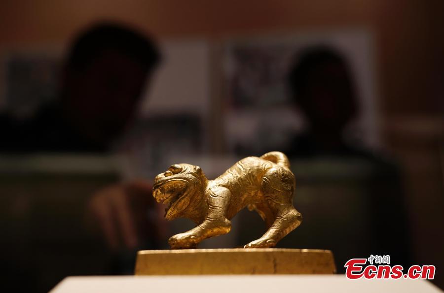 A gold seal from Meishan in Sichuan Province, used by rebels near the end of the Ming Dynasty (1368-1644), is on display at an exhibition at the National Museum of China in Beijing, Dec. 26, 2018. The exhibition displays 750 precious artifacts retrieved during police efforts in recent years fighting crime involving stolen cultural treasures, which hail from Neolithic times through to the Qing Dynasty. (Photo: China News Service/Du Yang)