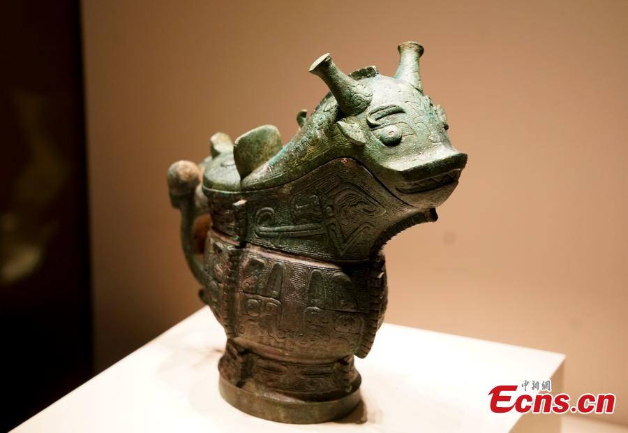 A bronze wine vessel retrieved by police after it was stolen from an ancient tomb in Wenxi of Shanxi Province is on display at an exhibition at the National Museum of China in Beijing, Dec. 26, 2018. The exhibition displays 750 precious artifacts retrieved during police efforts in recent years fighting crime involving stolen cultural treasures, which hail from Neolithic times through to the Qing Dynasty. (Photo: China News Service/Du Yang)
