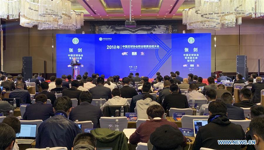 File photo taken on Dec. 20, 2018 shows people attending the Chinese Footbal Association Professional League Conclusion Conference in east China\'s Shanghai Municipality. The Chinese Football Association introduced more exacting regulations from next season to dampen spending by clubs, including a salary cap. The CFA has also decided to set standards for national team players and announced a plan to raise the level of women\'s football. (Xinhua/Ding Ting)