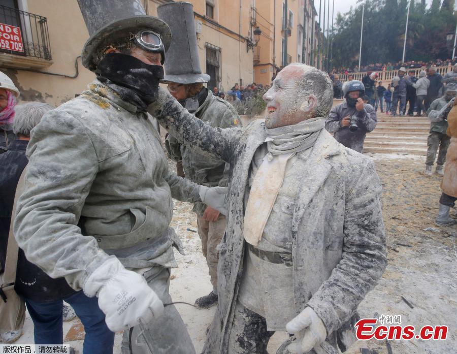 Revelers battle with flour and eggs during the traditional \