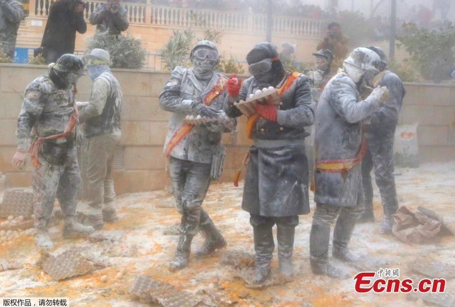 Revelers battle with flour and eggs during the traditional \
