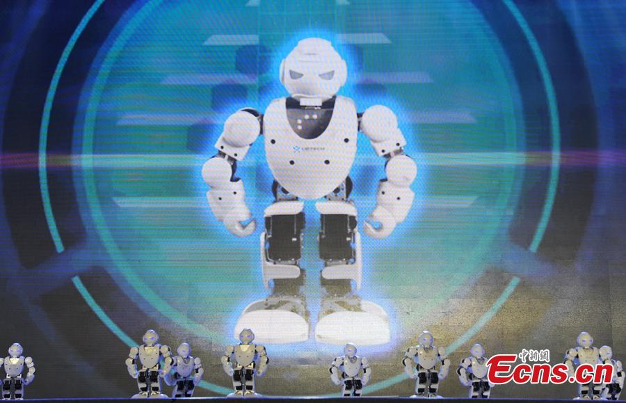 A team of Titan robots perform at the finals of the First National Intelligent Sports Competition in Hangzhou, Zhejiang Province, Dec. 29, 2018. More than 1,400 finalists from across China will compete in 13 intelligent sports, including cycling, racing, golf, and shooting, in the following 2 days. (Photo: China News Service/Zhang Yin)