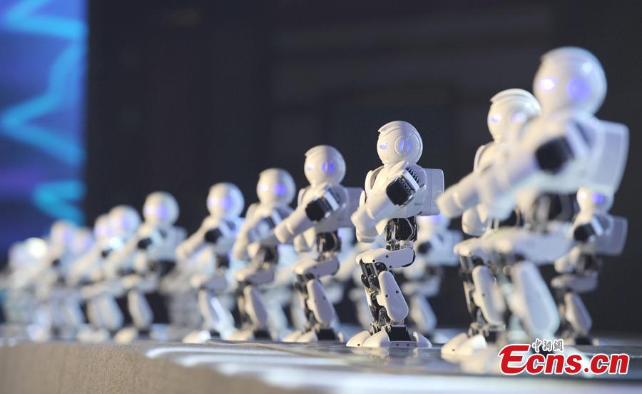 A team of Titan robots perform at the finals of the First National Intelligent Sports Competition in Hangzhou, Zhejiang Province, Dec. 29, 2018. More than 1,400 finalists from across China will compete in 13 intelligent sports, including cycling, racing, golf, and shooting, in the following 2 days. (Photo: China News Service/Zhang Yin)
