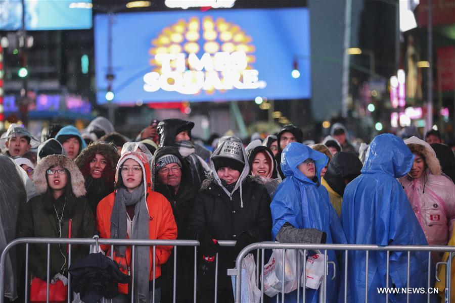 People wait for the New Year celebration on Times Square in New York, the United States, on Dec. 31, 2018. (Xinhua/Wang Ying)