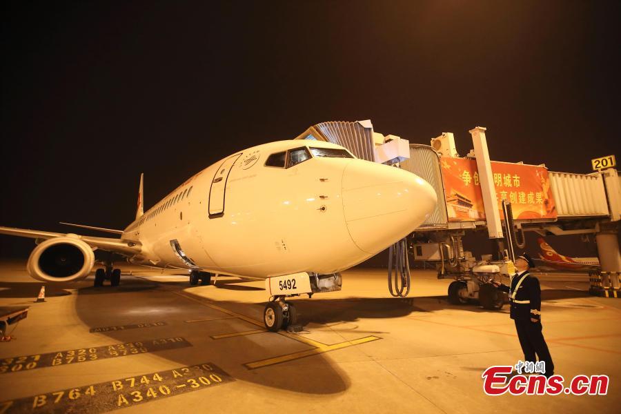 Veteran pilot Yang Jianxi takes a look at an aircraft in Taiyuan, Shanxi Province, Jan. 1, 2019. Since starting his career in 1976, Yang has amassed more than 27,000 hours of total flight time with no errors on his record. In 2018, he was awarded the Outstanding Pilot medal by the Civil Aviation Administration of China, highest honor for a Chinese civil aviation pilot. (Photo: China News Service/Zhang Yun)