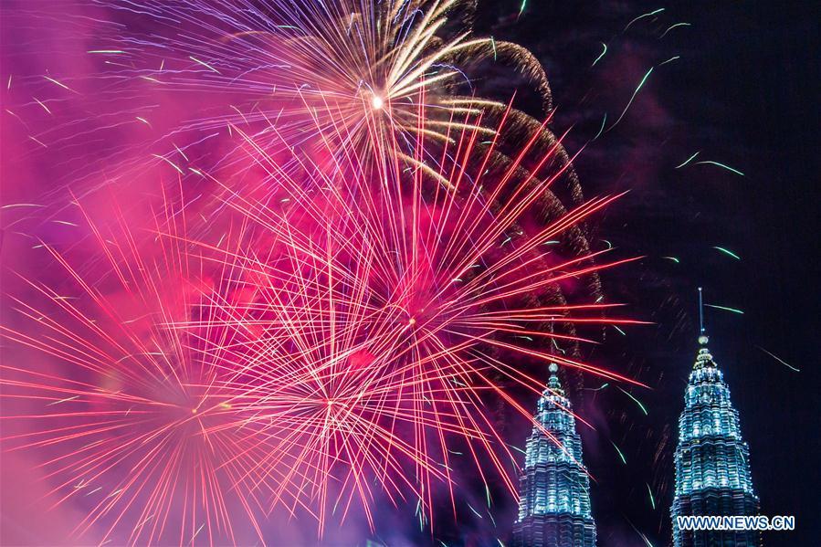 New Year fireworks are seen near the Petronas Twin Towers in Kuala Lumpur, Malaysia, Jan. 1, 2019. (Xinhua/Zhu Wei)