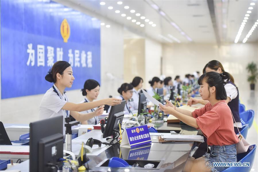 Staff members serve tax payers at the Fengze Street taxation hall of the Quanzhou tax bureau in Quanzhou City, southeast China\'s Fujian Province, Sept. 13, 2018. The 18th Central Committee of the Communist Party of China (CPC) held the third plenary session in November, 2013. In the five years since then, China\'s reform momentum had been particularly strong as the CPC decided to advance reform in all aspects during the meeting. Since the third plenary session, Chinese President Xi Jinping has presided over at least 45 high-profile meetings on advancing reforms, during which 400 documents and 1,932 reform plans have been launched. As a result, China\'s reform has been expanded from the economic field to a broad sphere including administrative management, culture, society, ecological conservation, Party building, and the military. (Xinhua/Song Weiwei)