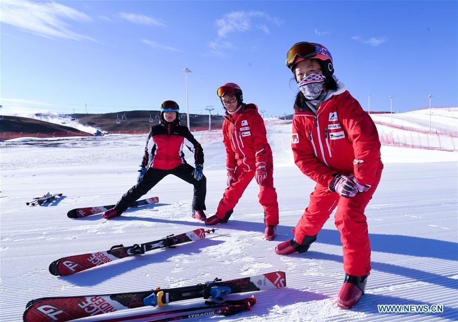 Students prepare for skiing in Jining District of Ulanqab, north China\'s Inner Mongolia Autonomous Region, Dec. 27, 2018. China\'s primary and middle schools have been urged to improve education for all-around student development, according to a directive issued by authorities. Jointly issued by the Ministry of Education and other eight agencies, the circular asked schools to offer courses that are in accord with the national syllabus in terms of their quantity and quality. The enhancement of courses\' difficulty levels and speed at random and in disregard of the curriculum is prohibited, according to the circular. Primary and junior middle schools are not allowed to set up any \