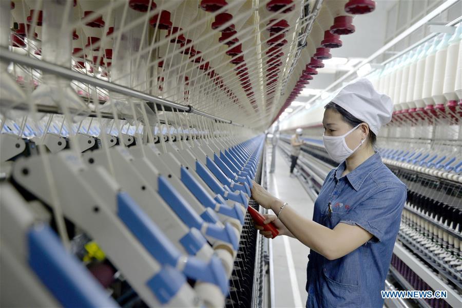 People work at a textile factory in the Xingtai economic development zone in Xingtai City, north China\'s Hebei Province, Dec. 20, 2018. The 18th Central Committee of the Communist Party of China (CPC) held the third plenary session in November, 2013. In the five years since then, China\'s reform momentum had been particularly strong as the CPC decided to advance reform in all aspects during the meeting. Since the third plenary session, Chinese President Xi Jinping has presided over at least 45 high-profile meetings on advancing reforms, during which 400 documents and 1,932 reform plans have been launched. As a result, China\'s reform has been expanded from the economic field to a broad sphere including administrative management, culture, society, ecological conservation, Party building, and the military. (Xinhua/Zhu Xudong)