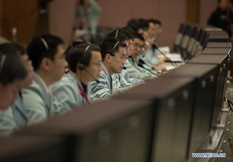 Technicians work at the Beijing Aerospace Control Center (BACC) in Beijing, capital of China, Jan. 3, 2019. China\'s Chang\'e-4 probe touched down on the far side of the moon Thursday, becoming the first spacecraft soft-landing on the moon\'s uncharted side never visible from Earth. The probe, comprising a lander and a rover, landed at the preselected landing area on the far side of the moon at 10:26 a.m. Beijing Time (0226 GMT), the China National Space Administration announced. (Xinhua/Jin Liwang)