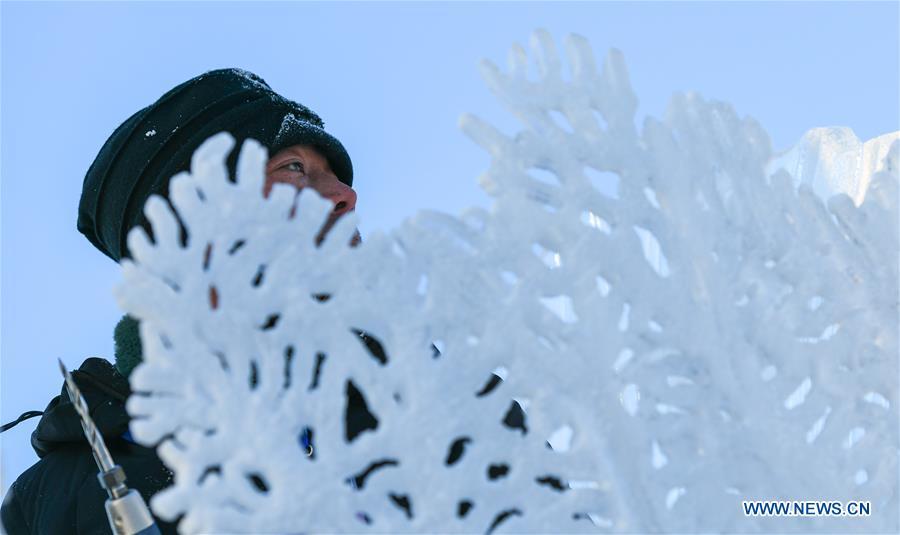 A contestant carves an ice sculpture during an international ice sculpture competition in Harbin, capital of northeast China\'s Heilongjiang Province, Jan. 2, 2019. A total of 16 teams from 12 countries and regions took part in the competition. (Xinhua/Wang Song)