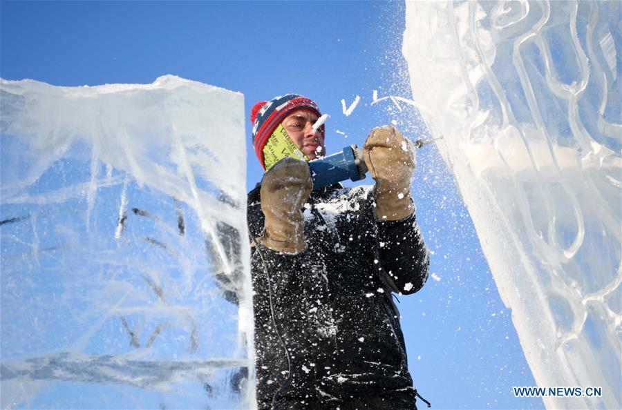 A contestant carves an ice sculpture during an international ice sculpture competition in Harbin, capital of northeast China\'s Heilongjiang Province, Jan. 2, 2019. A total of 16 teams from 12 countries and regions took part in the competition. (Xinhua/Wang Jianwei)