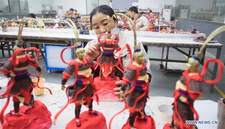 A craftswoman makes copper artwork at a factory workshop in Jiande City, east China\'s Zhejiang Province, Jan. 2, 2019. A traditional sanitary ware production company, Tong Shifu, meaning Copper Master, has converted itself into an enterprise that designs and makes copper artwork in collaboration with museum, cartoon firm and artist\'s studio. With the annual output reaching 500 million yuan (about 72.9 million U.S. dollars), the company has succeeded in industrial transformation. (Xinhua/Weng Xinyang)