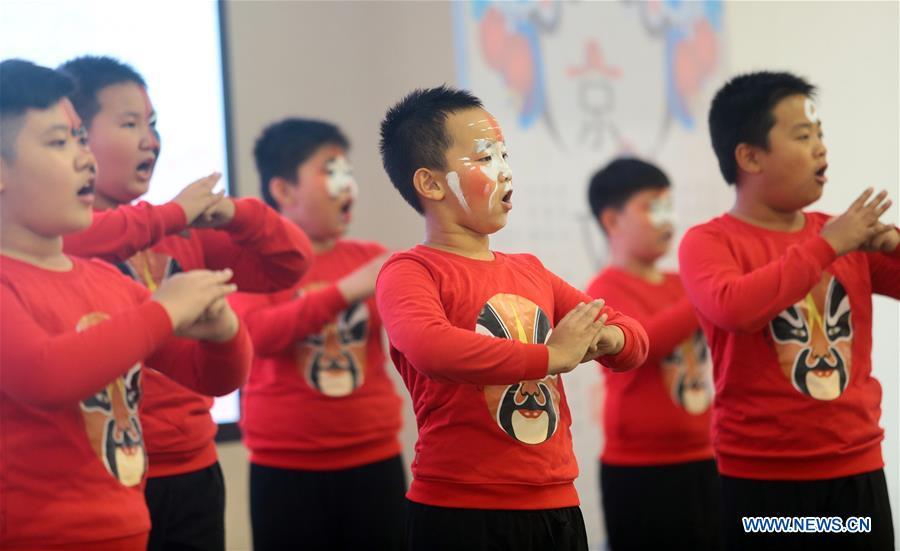 Pupils perform Beijing Opera at a primary school in Tianjin, north China, Sept. 26, 2018. China\'s primary and middle schools have been urged to improve education for all-around student development, according to a directive issued by authorities. Jointly issued by the Ministry of Education and other eight agencies, the circular asked schools to offer courses that are in accord with the national syllabus in terms of their quantity and quality. The enhancement of courses\' difficulty levels and speed at random and in disregard of the curriculum is prohibited, according to the circular. Primary and junior middle schools are not allowed to set up any \