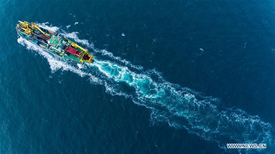 Aerial photo taken on Jan. 8, 2019 shows the Chinese-built dredging vessel Tian Kun Hao sailing on the sea. Tian Kun Hao, a Chinese-built dredging vessel, which is the largest of its kind in Asia, returned to the shipyard Wednesday after completing its sea trial of nearly three months. The 140-meter-long, 27.8-meter-wide vessel can dig as deep as 35 meters under the sea floor and dredge 6,000 cubic meters per hour, according to its investor, Tianjin Dredging Co., a subsidiary of China Communication Construction Co. (Xinhua)