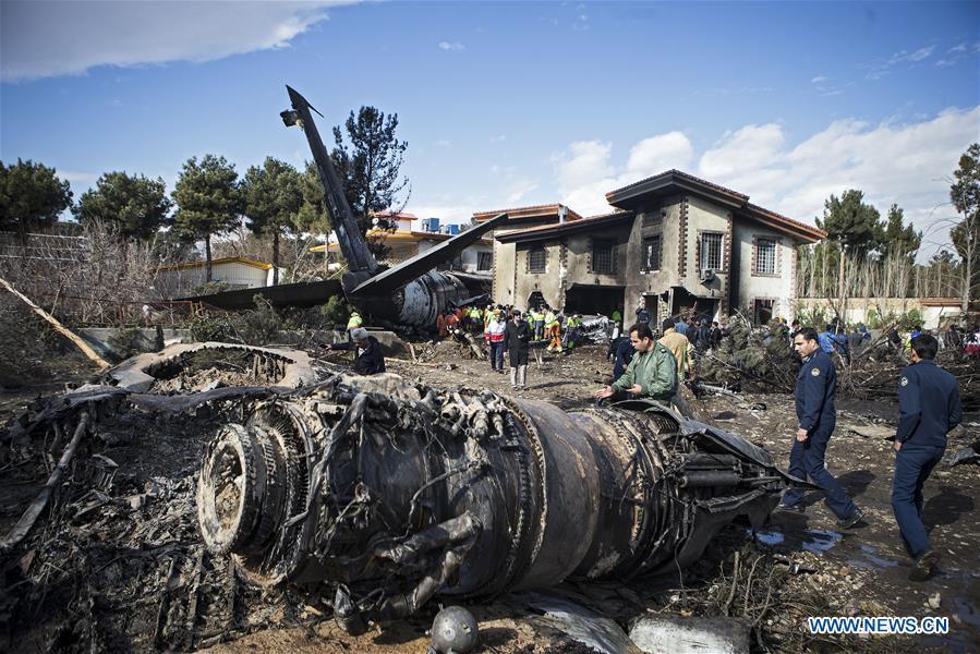 Rescuers work at the crash site of a Boeing 707 plane in Karaj, Iran, Jan. 14, 2019. At least 15 people were killed on Monday in the crash. (Xinhua/Ahmad Halabisaz)