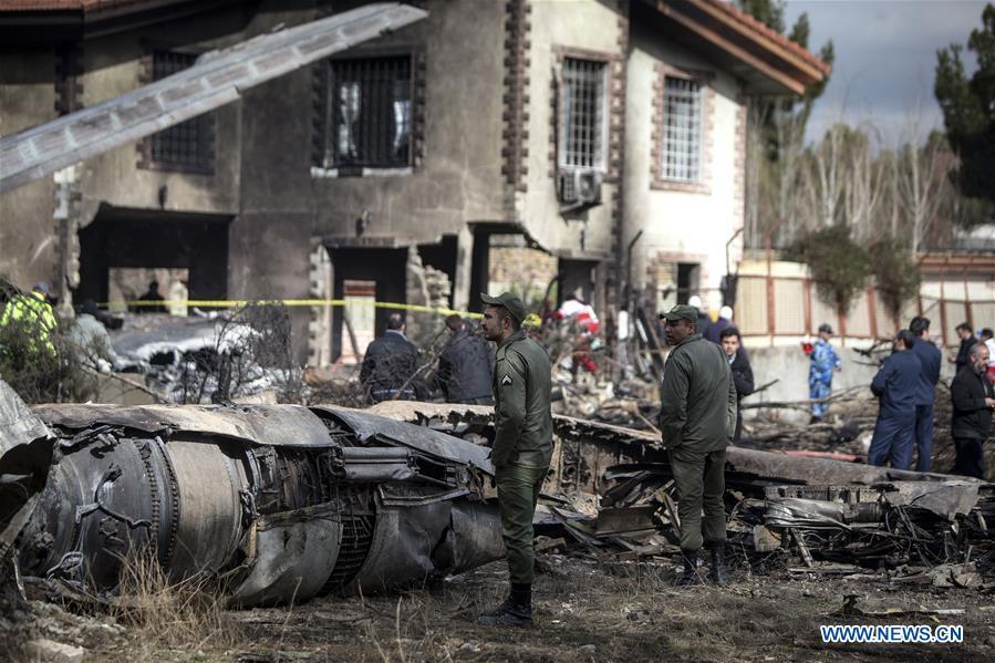Rescuers work at the crash site of a Boeing 707 plane in Karaj, Iran, Jan. 14, 2019. At least 15 people were killed on Monday in the crash. (Xinhua/Ahmad Halabisaz)