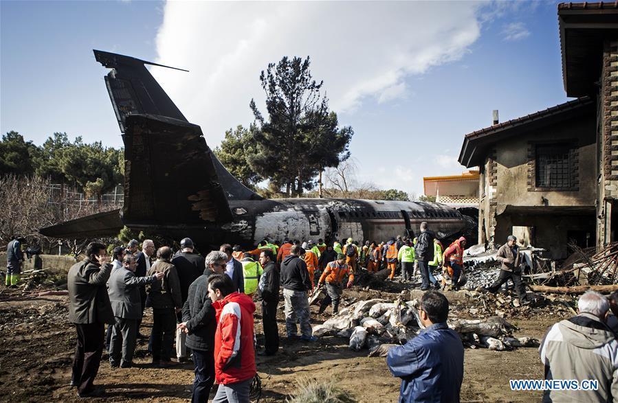 Rescuers work at the crash site of a Boeing 707 plane in Karaj, Iran, Jan. 14, 2019. At least 15 people were killed on Monday in the crash. (Xinhua/Ahmad Halabisaz)