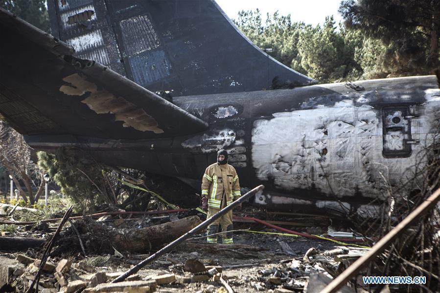 A rescuer works at the crash site of a Boeing 707 plane in Karaj, Iran, Jan. 14, 2019. At least 15 people were killed on Monday in the crash. (Xinhua/Ahmad Halabisaz)
