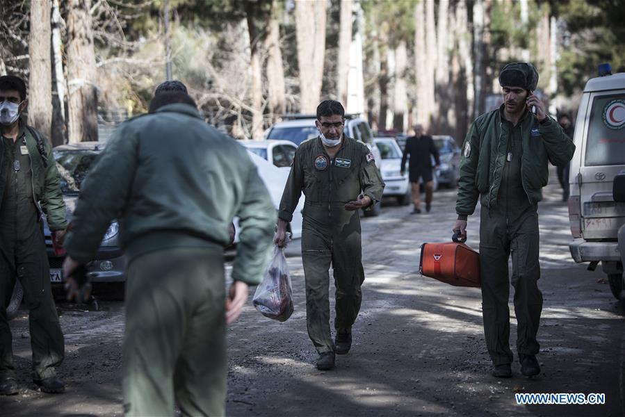 Rescuers work at the crash site of a Boeing 707 plane in Karaj, Iran, Jan. 14, 2019. At least 15 people were killed on Monday in the crash. (Xinhua/Ahmad Halabisaz)