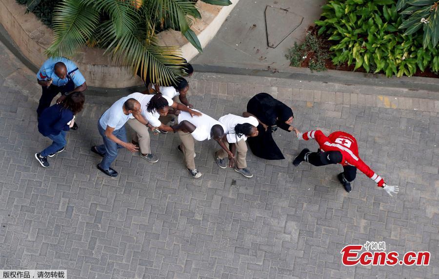 Civilians flee the scene at a hotel complex in Nairobi, Kenya Tuesday, Jan. 15, 2019. Terrorists attacked an upscale hotel complex in Kenya\'s capital Tuesday, sending people fleeing in panic as explosions and heavy gunfire reverberated through the neighborhood. (Photo/Agencies)