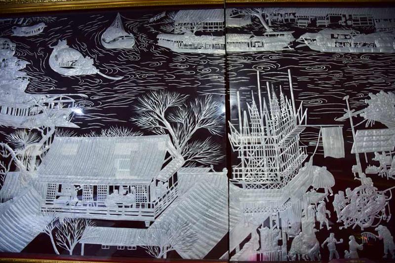 This version of Riverside Scene at Qingming Festival, 28 meters in length and 1.3 meters in width, was made with pieces of more than 6,000 metal cans by Gao Baoan in Linfen city, Shanxi Province. (Photo provided to chinadaily.com.cn)