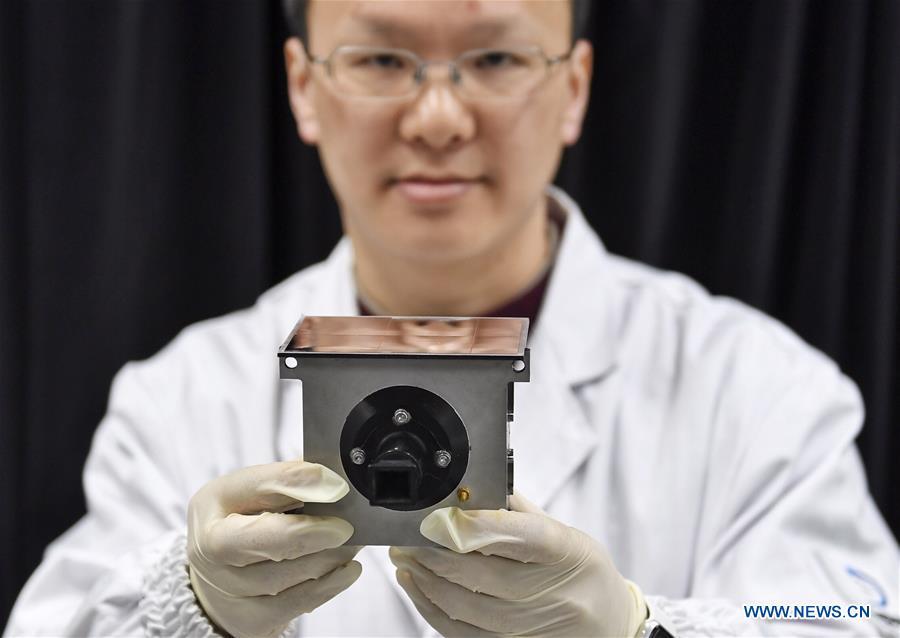 A staff member of Institute of Optics and Electronics of the Chinese Academy of Sciences shows a sample of the topographical camera installed on the lander of the Chang\'e-4 probe in Chengdu, southwest China\'s Sichuan Province, Jan. 17, 2019. The topographical camera installed on the lander of the Chang\'e-4 probe is responsible for both taking colorful high-resolution images on the lunar surface and monitoring the lunar rover Yutu-2. China\'s Chang\'e-4 lunar probe, comprising a lander and a rover, landed on the far side of the moon on Jan. 3, 2019. (Xinhua/Liu Kun)
