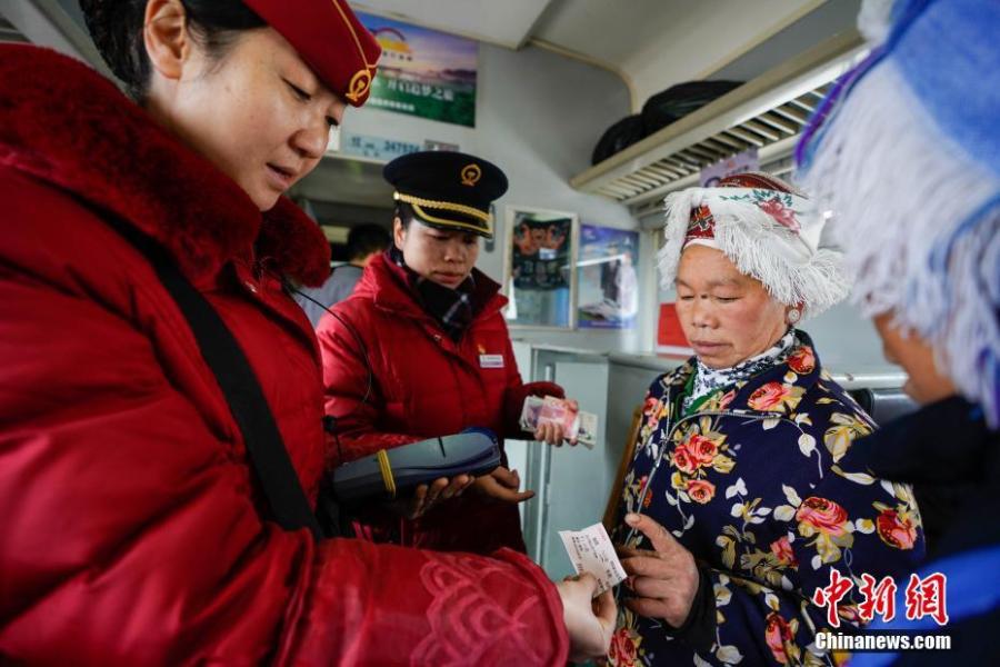 Passengers are seen on a train to Guiyang City, Guizhou Province, Jan. 17, 2019. The railway line linking Guiyang City and Yuping County in Tongren County has been running for 44 years - opening in 1975 - connecting the villages of the many ethnic groups residing deep in the mountains with the outside world. The 342-km journey takes about seven hours - incredibly slow when compared with the speeds of China’s increasingly ubiquitous bullet trains. (Photo: China News Service/He Junyi)