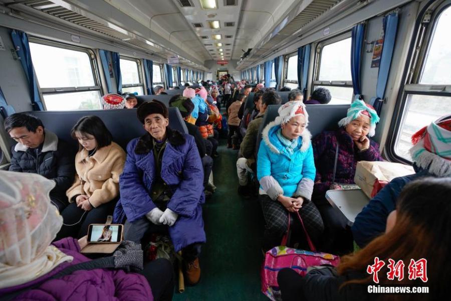 Passengers are seen on a train to Guiyang City, Guizhou Province, Jan. 17, 2019. The railway line linking Guiyang City and Yuping County in Tongren County has been running for 44 years - opening in 1975 - connecting the villages of the many ethnic groups residing deep in the mountains with the outside world. The 342-km journey takes about seven hours - incredibly slow when compared with the speeds of China\'s increasingly ubiquitous bullet trains. (Photo: China News Service/He Junyi)