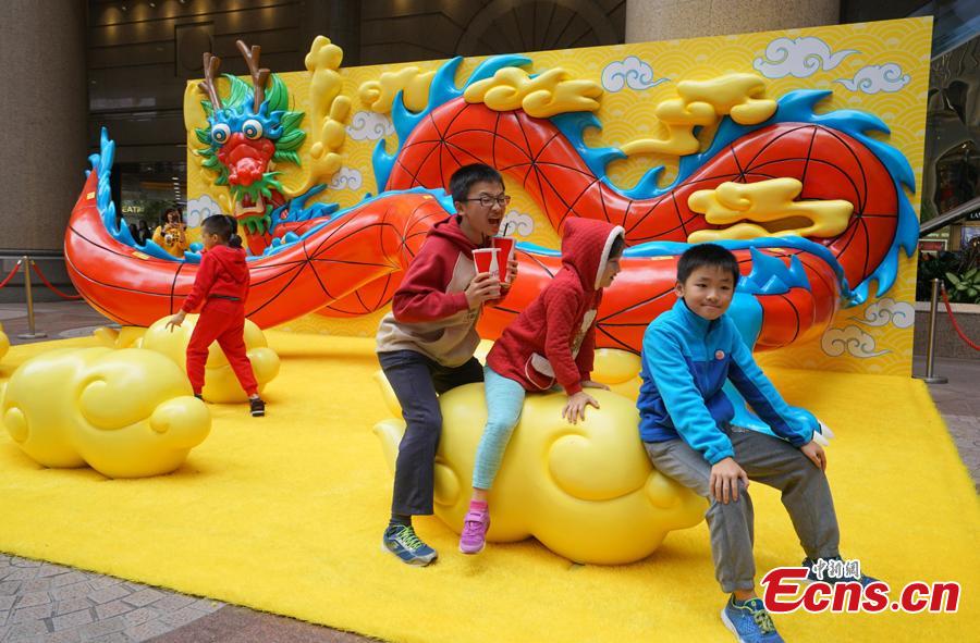 A shopping mall in Causeway Bay, Hong Kong, has set up a giant wall of auspicious animals at its gate to welcome the Chinese Lunar New Year. (Photo: China News Service/Zhang Wei)