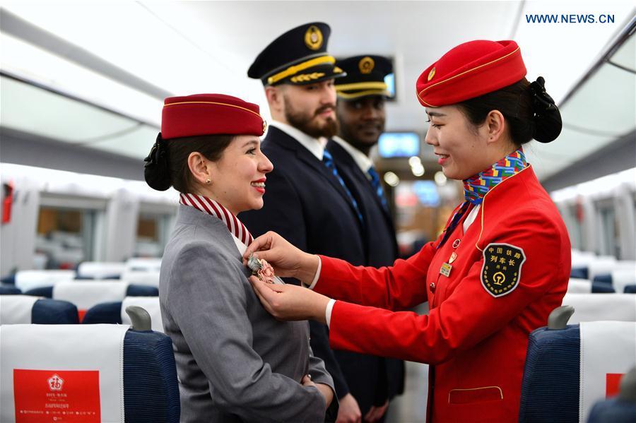 Foreign volunteers receive professional training at Xi\'an North Railway Station in Xi\'an, capital of northwest China\'s Shaanxi Province, Jan. 20, 2019. Three foreign student volunteers from Xi\'an Jiaotong University came to Xi\'an North Railway Station on Sunday to familiarize themselves with the train staff members\' work. They would serve passengers during the Spring Festival travel rush. The Spring Festival, or the Year of the Pig in the Chinese lunar calendar, will begin on Feb. 5 this year. The 40-day 2019 Spring Festival travel rush started on Jan. 21, with 3 billion trips expected to be made. (Xinhua/Tang Zhenjiang)