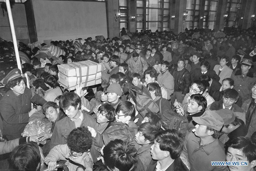 Passengers queue to enter the Beijing Railway Station during the Spring Festival travel rush in Beijing, capital of China, Jan. 12, 1993. Returning to hometowns remains the most important part of the Chinese Spring Festival. Whether self-driving, or taking the trains or flights, homecomings and family gatherings are a priority for many Chinese. The annual travel rush around the festival, known as \