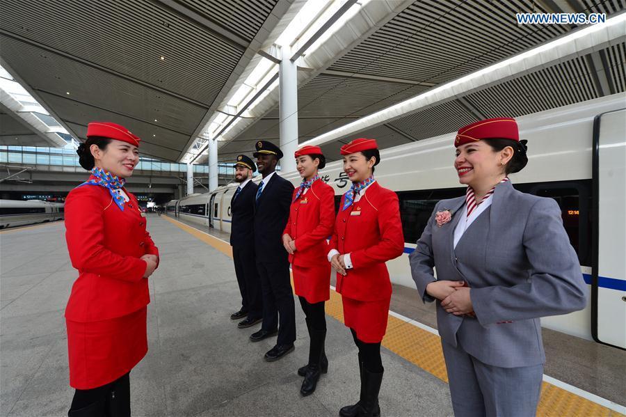 Foreign volunteers receive professional training at Xi\'an North Railway Station in Xi\'an, capital of northwest China\'s Shaanxi Province, Jan. 20, 2019. Three foreign student volunteers from Xi\'an Jiaotong University came to Xi\'an North Railway Station on Sunday to familiarize themselves with the train staff members\' work. They would serve passengers during the Spring Festival travel rush. The Spring Festival, or the Year of the Pig in the Chinese lunar calendar, will begin on Feb. 5 this year. The 40-day 2019 Spring Festival travel rush started on Jan. 21, with 3 billion trips expected to be made. (Xinhua/Tang Zhenjiang)