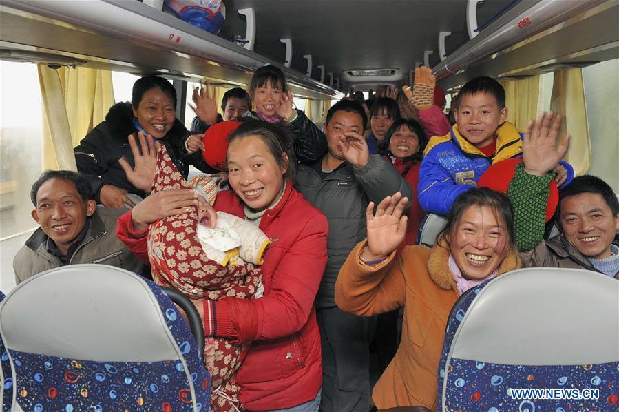 Migrant workers of a private enterprise get on a bus heading for their hometowns in Shaoxing, east China\'s Zhejiang Province, Jan. 28, 2011. Returning to hometowns remains the most important part of the Chinese Spring Festival. Whether self-driving, or taking the trains or flights, homecomings and family gatherings are a priority for many Chinese. The annual travel rush around the festival, known as \