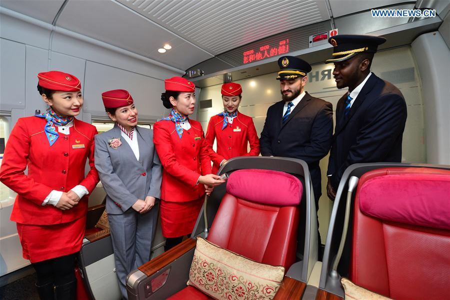 Foreign volunteers receive professional training at Xi\'an North Railway Station in Xi\'an, capital of northwest China\'s Shaanxi Province, Jan. 20, 2019. Three foreign student volunteers from Xi\'an Jiaotong University came to Xi\'an North Railway Station on Sunday to familiarize themselves with the train staff members\' work. They would serve passengers during the Spring Festival travel rush. The Spring Festival, or the Year of the Pig in the Chinese lunar calendar, will begin on Feb. 5 this year. The 40-day 2019 Spring Festival travel rush started on Jan. 21, with 3 billion trips expected to be made. (Xinhua/Tang Zhenjiang)