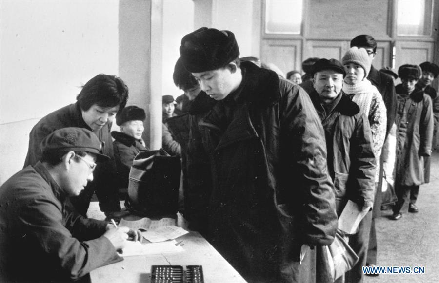 File Photo taken on Jan. 6, 1984 shows the newly-set group ticket desk at the Beijing Railway Station in Beijing, capital of China. Returning to hometowns remains the most important part of the Chinese Spring Festival. Whether self-driving, or taking the trains or flights, homecomings and family gatherings are a priority for many Chinese. The annual travel rush around the festival, known as \