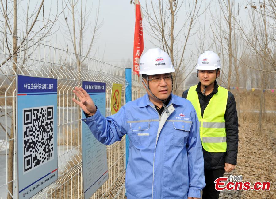 A technician at a pond that has been treated for pollution in Xiongan New Area in North China\'s Hebei Province. Progress has been made two years after China announced the establishment of Xiongan New Area in April 2017, spanning three counties in Hebei Province about 100 km southwest of Beijing. (Photo: China News Service/Han Bing)