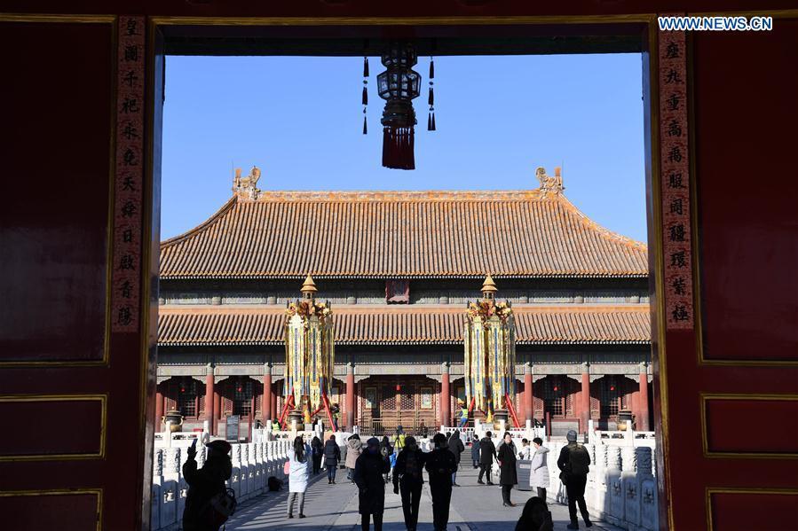 Longevity lanterns are installed before the Qianqing Gong, or the Palace of Heavenly Purity, at the Palace Museum, also known as the Forbidden City, in Beijing, capital of China, Jan. 21, 2019. The traditional lanterns recovered by the Palace Museum in accordance with historical archives from the Qing Dynasty (1644-1911) are opened to the public Monday, as a part of the exhibition of \
