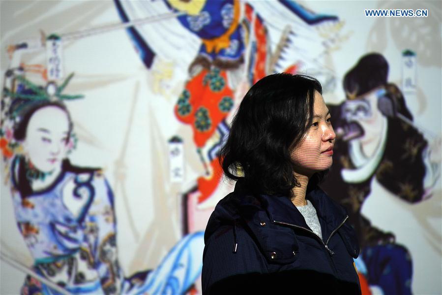 A girl visits the digital immersive experience exhibition to be held at the Palace Museum, also known as the Forbidden City, in Beijing, capital of China, Jan. 21, 2019. As a part of the exhibition of \