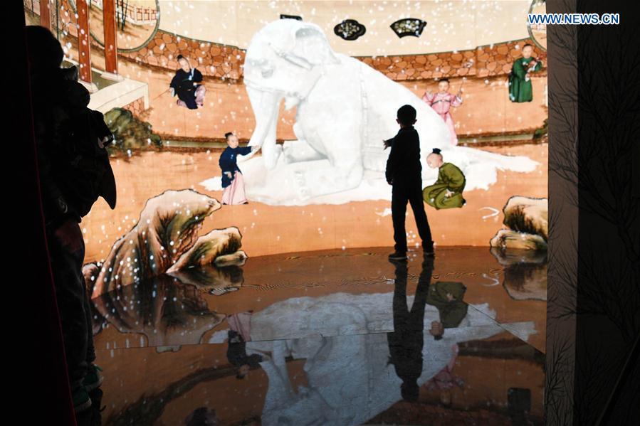 People visit the digital immersive experience exhibition to be held at the Palace Museum, also known as the Forbidden City, in Beijing, capital of China, Jan. 21, 2019. As a part of the exhibition of \
