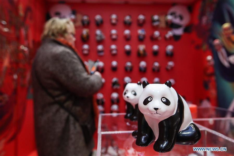 A visitor looks at exhibits in a shopping mall at Potsdamer Platz in Berlin, capital of Germany, on Jan. 24, 2019. \