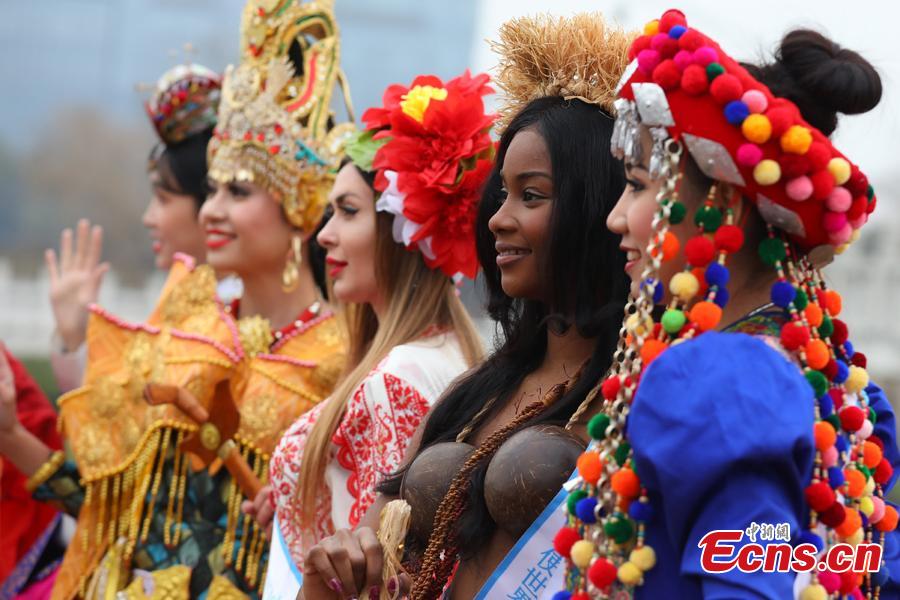 Contestants of the 53rd Miss All Nations Pageant brave the winter chill to pose for a photo in Nanjing, east China\'s Jiangsu Province, Jan. 28, 2019. The pageant will be held on Jan. 29 to promote Eco-Tourism. (Photo: China News Service/Yang Bo)