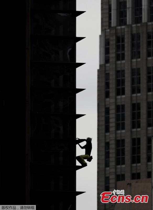 French urban climber Alain Robert stages his first climb in the Philippines as he scales a 43-floor skyscraper in Makati City, Manila, the Philippines, Jan. 29, 2019. (Photo/Agencies)