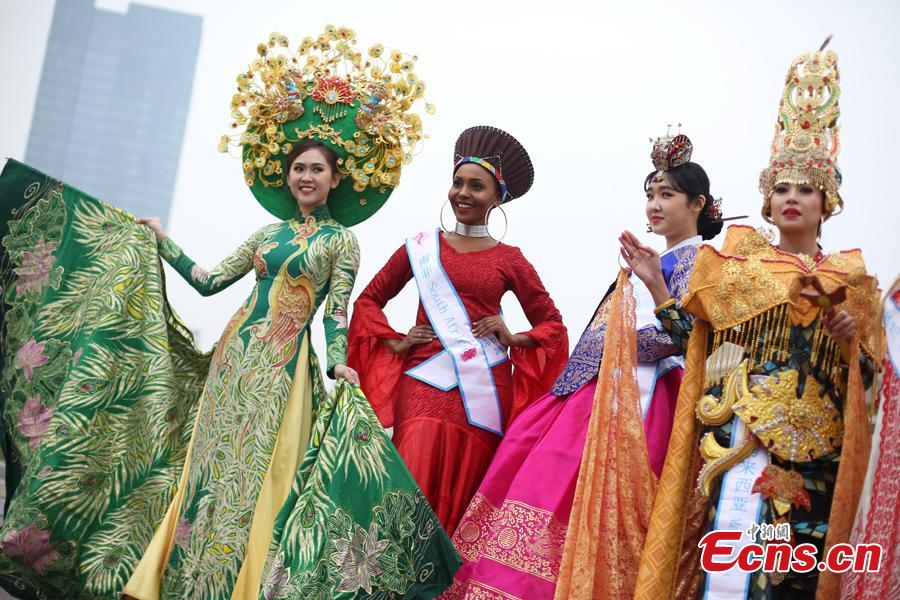 Contestants of Miss All Nations Pageant pose for photo in Nanjing, east China\'s Jiangsu Province, Jan. 29, 2019. The annual event is held to promote Eco-Tourism. Beauties from 42 countries and regions will compete at the annual pageant. (Photo: China News Service/Yang Bo)